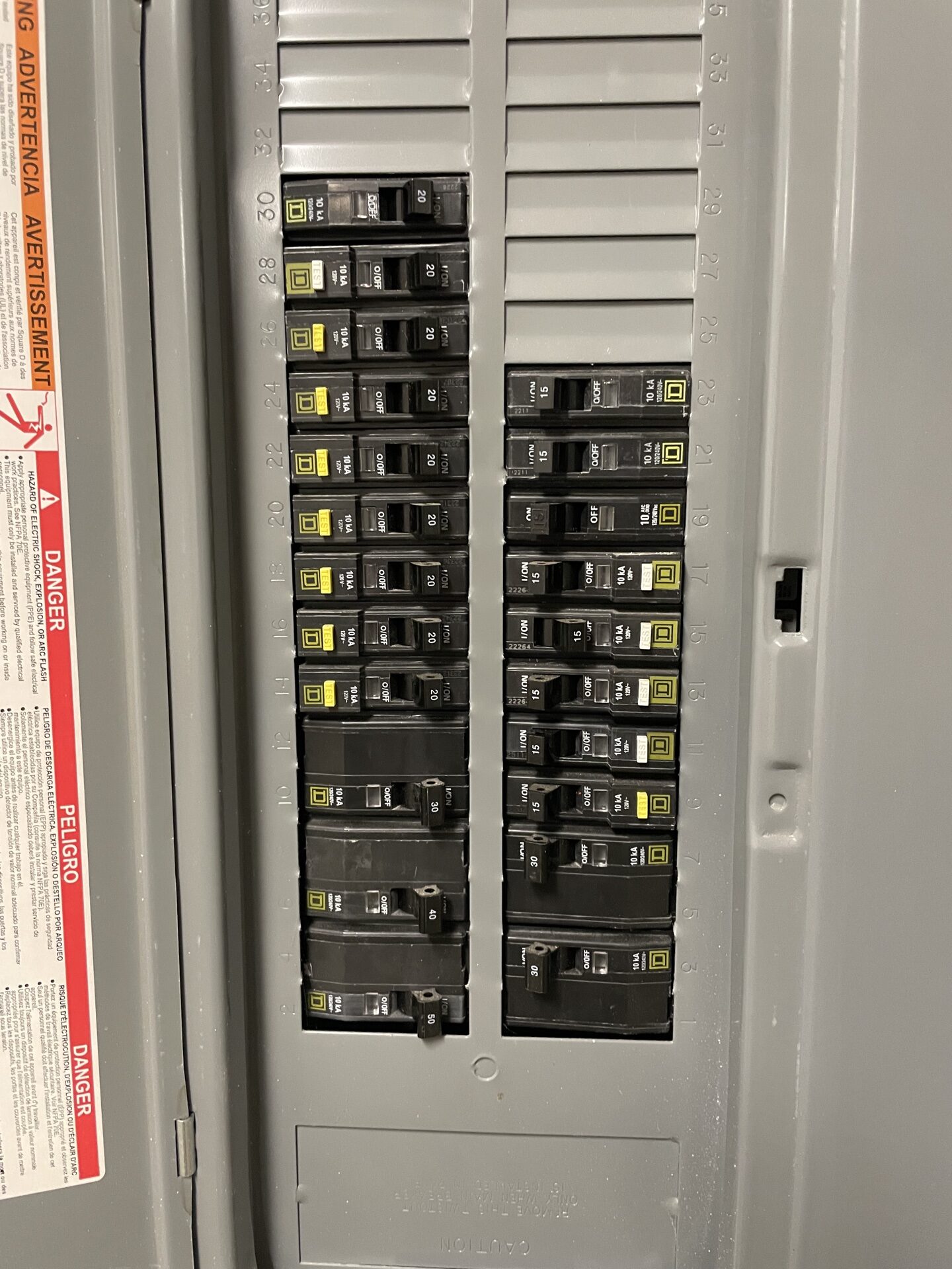 Square D breaker panel interior with organized 20A / 30A / 40A / 50A circuits