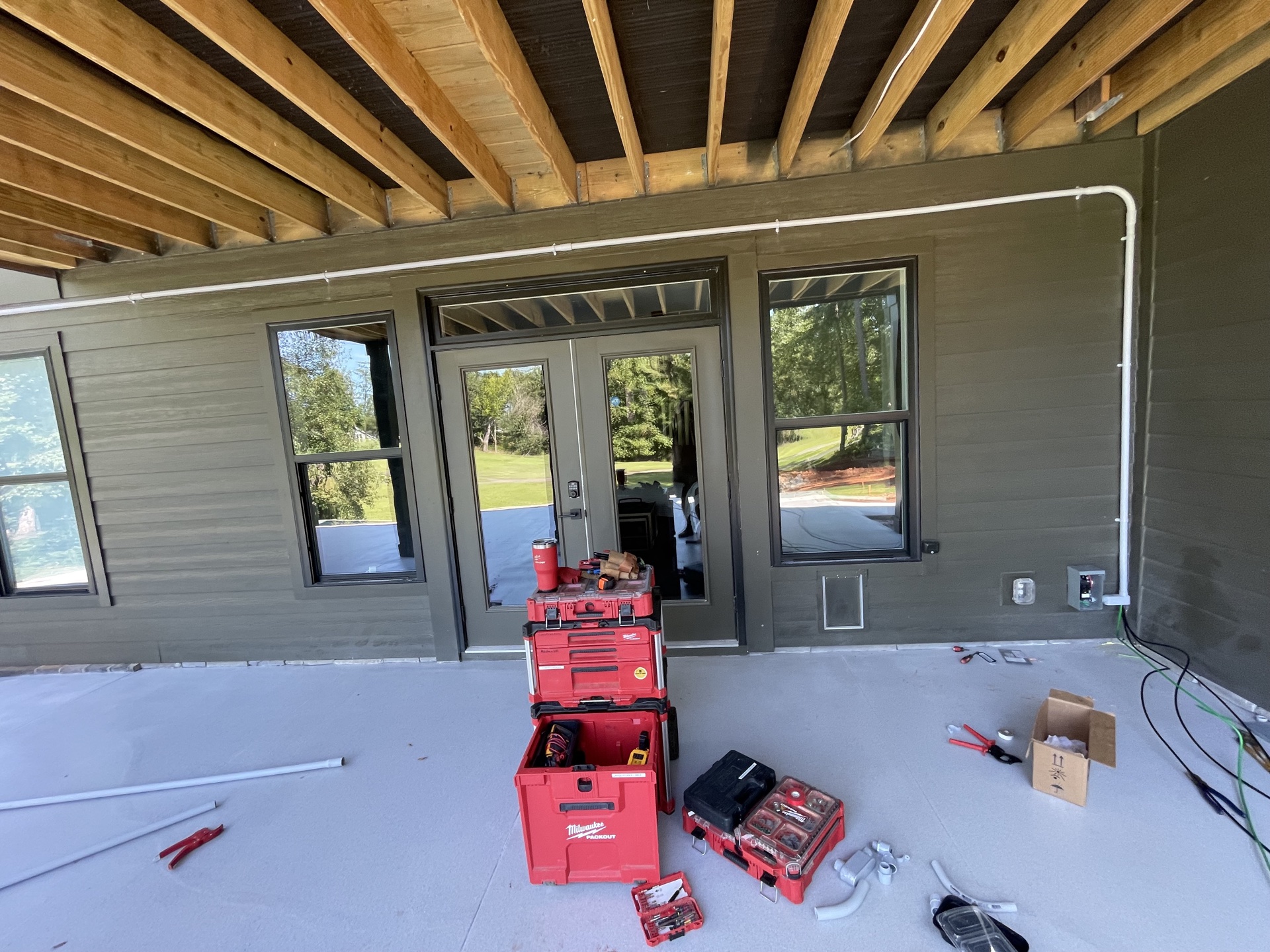 Clean conduit routing on new covered deck addition with exposed ceiling