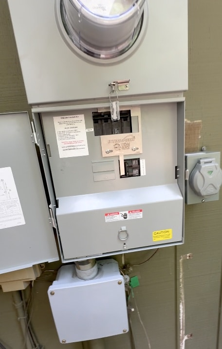 Sunset Electric generator interlock kit install with meter base, interlock plate on the panel, and 50A generator inlet box